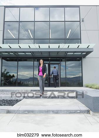 Businesswoman walking outside office building View Large Photo Image Stock Photo - Businesswoman walking outside office building. Fotosearch
