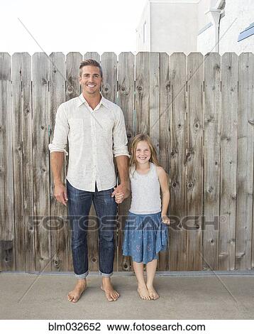 Caucasian father and daughter holding hands outdoors View Large Photo Image Stock Image - Caucasian father and daughter holding hands outdoors. Fotosearch