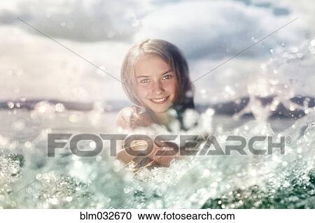 Caucasian girl splashing in lake View Large Photo Image Stock Image - Caucasian girl splashing in lake. Fotosearch