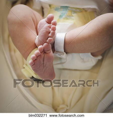 Close up of feet of mixed race newborn baby View Large Photo Image Stock Image - Close up of feet of mixed race newborn baby. Fotosearch