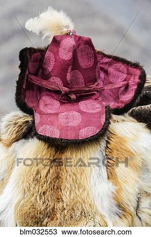 Close up of person wearing traditional hat and fur coat View Large Photo Image Stock Image - Close up of person wearing traditional hat and fur coat. Fotosearch