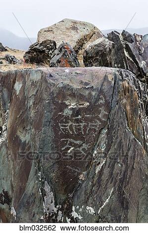 Stock Image - Close up of petroglyphs on rock formations, Altai Tavn Bogd National Park, Bayan Ulgii, Mongolia. Fotosearch