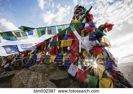 Low angle view of colorful prayer flags on monastery wall View Large Photo Image Stock Photo - Low angle view of colorful prayer flags on monastery wall. Fotosearch