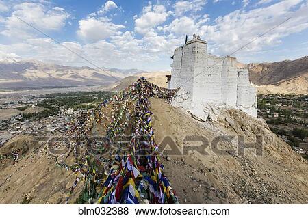 Low angle view of colorful prayer flags under hillside monastery, Leh, Ladakh, India View Large Photo Image Stock Photo - Low angle view of colorful prayer flags under hillside monastery, Leh, Ladakh, India. Fotosearch