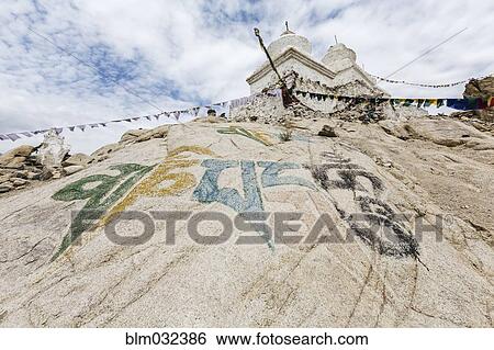 Low angle view of rock art on hillside under Shey Palace, Leh, Ladakh, India View Large Photo Image Stock Photograph - Low angle view of rock art on hillside under Shey Palace, Leh, Ladakh, India. Fotosearch