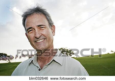 Mixed race man smiling outdoors View Large Photo Image Stock Photograph - Mixed race man smiling outdoors. Fotosearch