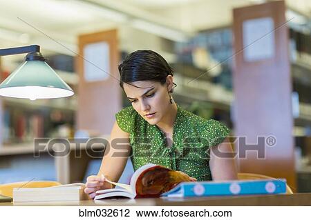 Mixed race student studying in library View Large Photo Image Stock Image - Mixed race student studying in library. Fotosearch