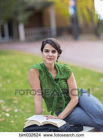 Mixed race student studying on campus View Large Photo Image Picture - Mixed race student studying on campus. Fotosearch