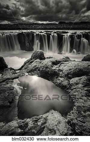 Rock formations over Sellfoss Falls and river, Myvatn, Iceland View Large Photo Image Stock Image - Rock formations over Sellfoss Falls and river, Myvatn, Iceland. Fotosearch