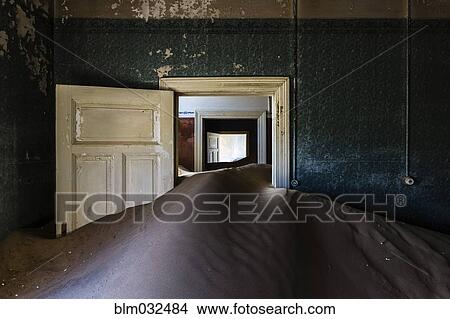 Sand dune in door frame of abandoned house View Large Photo Image Picture - Sand dune in door frame of abandoned house. Fotosearch