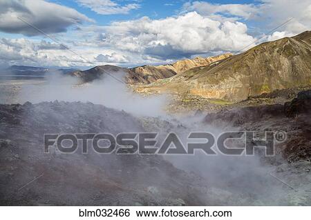 Steam rising from geyser in remote mountain landscape View Large Photo Image Stock Photograph - Steam rising from geyser in remote mountain landscape. Fotosearch