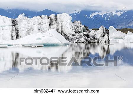 Vatnajokull Glacier reflected in still arctic water, Iceland View Large Photo Image Stock Photo - Vatnajokull Glacier reflected in still arctic water, Iceland. Fotosearch