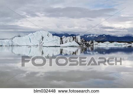 Vatnajokull Glacier reflected in still arctic water, Iceland View Large Photo Image Stock Photo - Vatnajokull Glacier reflected in still arctic water, Iceland. Fotosearch