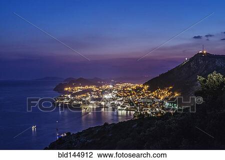 Aerial view of coastal city illuminated at night, Dubrovnik, Dubrovnik-Neretva, Croatia View Large Photo Image Stock Image - Aerial view of coastal city illuminated at night, Dubrovnik, Dubrovnik-Neretva, Croatia. Fotosearch
