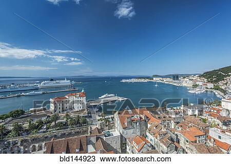 Stock Image - Aerial view of coastal city under blue sky, Split, Split, Croatia. Fotosearch