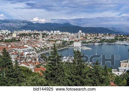 Stock Photography - Aerial view of coastal city under blue sky, Split, Split, Croatia. Fotosearch
