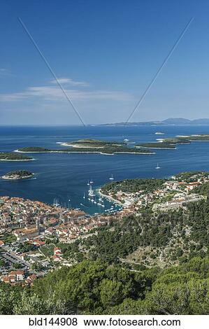 Aerial view of coastal town on hillside View Large Photo Image Stock Photo - Aerial view of coastal town on hillside. Fotosearch