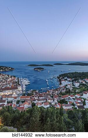 Aerial view of coastal town on hillside, Hvar, Split, Croatia View Large Photo Image Stock Image - Aerial view of coastal town on hillside, Hvar, Split, Croatia. Fotosearch