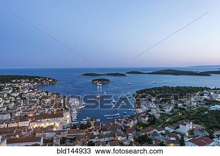 Stock Image - Aerial view of coastal town on hillside, Hvar, Split, Croatia. Fotosearch