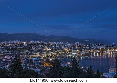 Aerial view of illuminated dock and cityscape of coastal town, Split, Split, Croatia View Large Photo Image Stock Photograph - Aerial view of illuminated dock and cityscape of coastal town, Split, Split, Croatia. Fotosearch