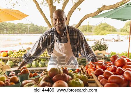 African American vendor smiling at farmers market View Large Photo Image Stock Photograph - African American vendor smiling at farmers market. Fotosearch