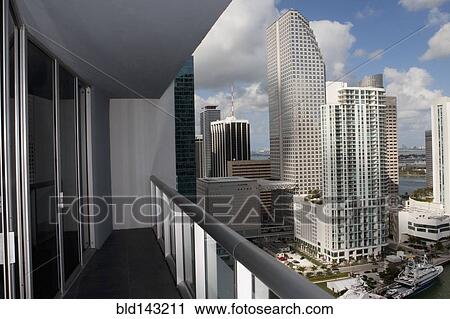 Stock Image - Balcony overlooking high rises in urban cityscape, Miami, Florida, United States. Fotosearch