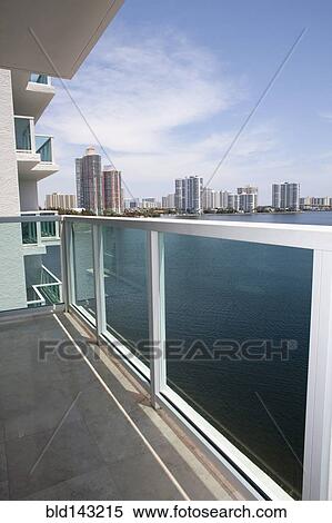 Balcony overlooking high rises in urban cityscape, Miami, Florida, United States View Large Photo Image Stock Photography - Balcony overlooking high rises in urban cityscape, Miami, Florida, United States. Fotosearch