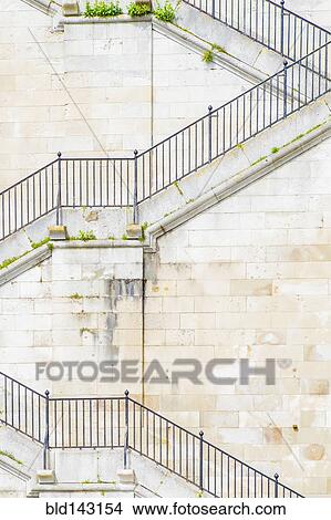Banister and staircase on tall building View Large Photo Image Picture - Banister and staircase on tall building. Fotosearch
