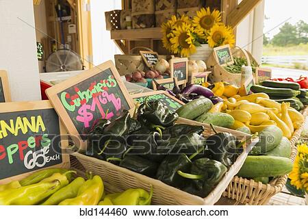 Stock Image - Baskets of produce at farmers market. Fotosearch
