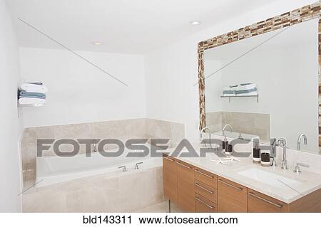 Bathtub, sinks and mirror in modern dining room View Large Photo Image Stock Image - Bathtub, sinks and mirror in modern dining room. Fotosearch