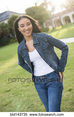 Black woman walking on lawn View Large Photo Image Stock Photography - Black woman walking on lawn. Fotosearch
