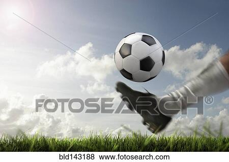 Blurred view of foot kicking soccer ball View Large Photo Image Stock Photo - Blurred view of foot kicking soccer ball. Fotosearch