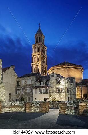 Stock Photo - Buildings and tower illuminated at dusk, Split, Split, Croatia. Fotosearch
