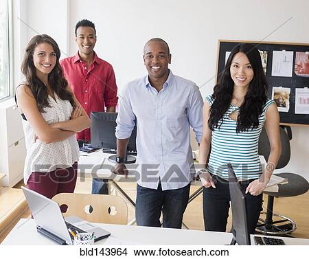 Picture - Business people smiling in office. Fotosearch