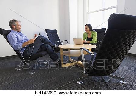 Business people working together in office View Large Photo Image Stock Image - Business people working together in office. Fotosearch