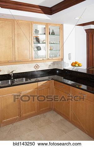Cabinets and counters in modern kitchen View Large Photo Image Stock Image - Cabinets and counters in modern kitchen. Fotosearch