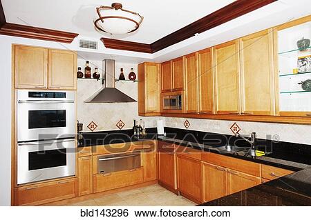 Cabinets and countertops in modern kitchen View Large Photo Image Stock Photograph - Cabinets and countertops in modern kitchen. Fotosearch