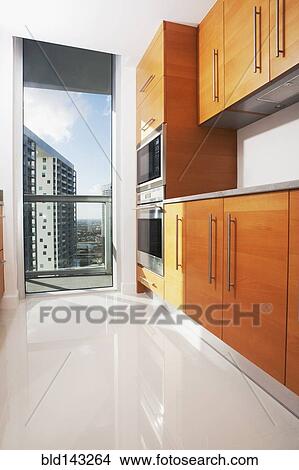 Picture - Cabinets and window in modern kitchen. Fotosearch
