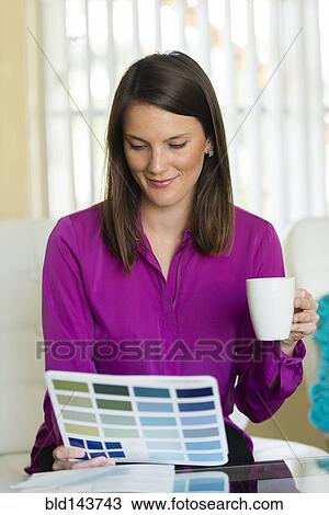 Caucasian businesswoman examining color swatches View Large Photo Image Stock Image - Caucasian businesswoman examining color swatches. Fotosearch