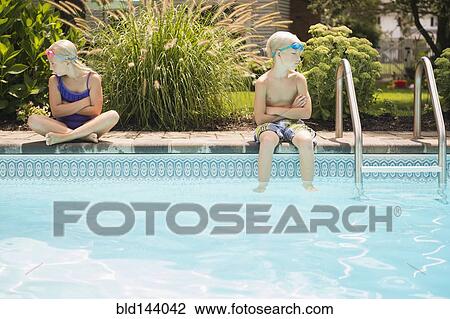 Caucasian children arguing at swimming pool View Large Photo Image Stock Image - Caucasian children arguing at swimming pool. Fotosearch