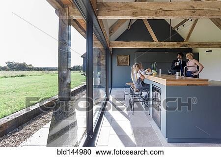 Caucasian family eating breakfast in kitchen View Large Photo Image Stock Image - Caucasian family eating breakfast in kitchen. Fotosearch