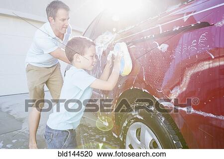 Caucasian father and son washing car in driveway View Large Photo Image Stock Image - Caucasian father and son washing car in driveway. Fotosearch