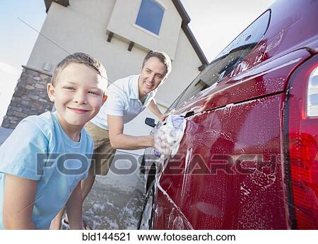 Caucasian father and son washing car in driveway View Large Photo Image Stock Image - Caucasian father and son washing car in driveway. Fotosearch