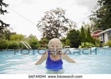 Picture - Caucasian girl in swimming pool. Fotosearch