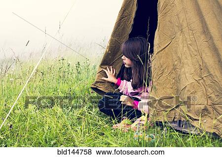 Caucasian girl sitting in camp tent View Large Photo Image Stock Photo - Caucasian girl sitting in camp tent. Fotosearch