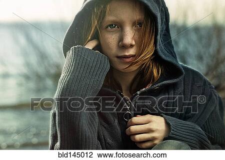 Caucasian girl wearing hooded sweater on beach View Large Photo Image Stock Image - Caucasian girl wearing hooded sweater on beach. Fotosearch