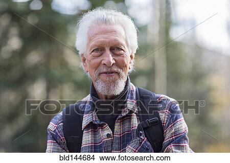 Caucasian hiker smiling in forest View Large Photo Image Picture - Caucasian hiker smiling in forest. Fotosearch