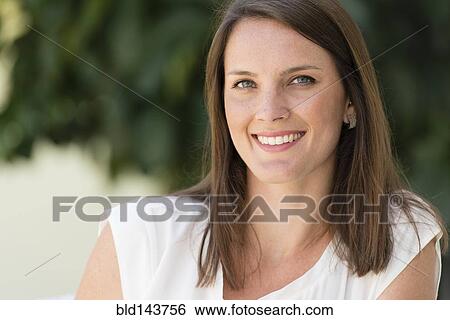 Caucasian woman smiling View Large Photo Image Stock Photograph - Caucasian woman smiling. Fotosearch