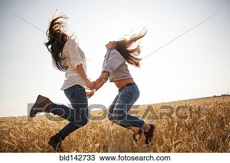 Caucasian women dancing in rural field View Large Photo Image Stock Image - Caucasian women dancing in rural field. Fotosearch