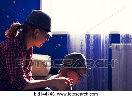 Stock Image - Caucasian women sitting together. Fotosearch